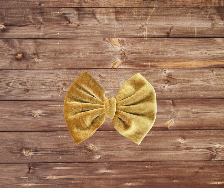 Velvet gold bow on clip