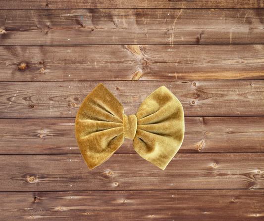 Velvet gold bow on clip